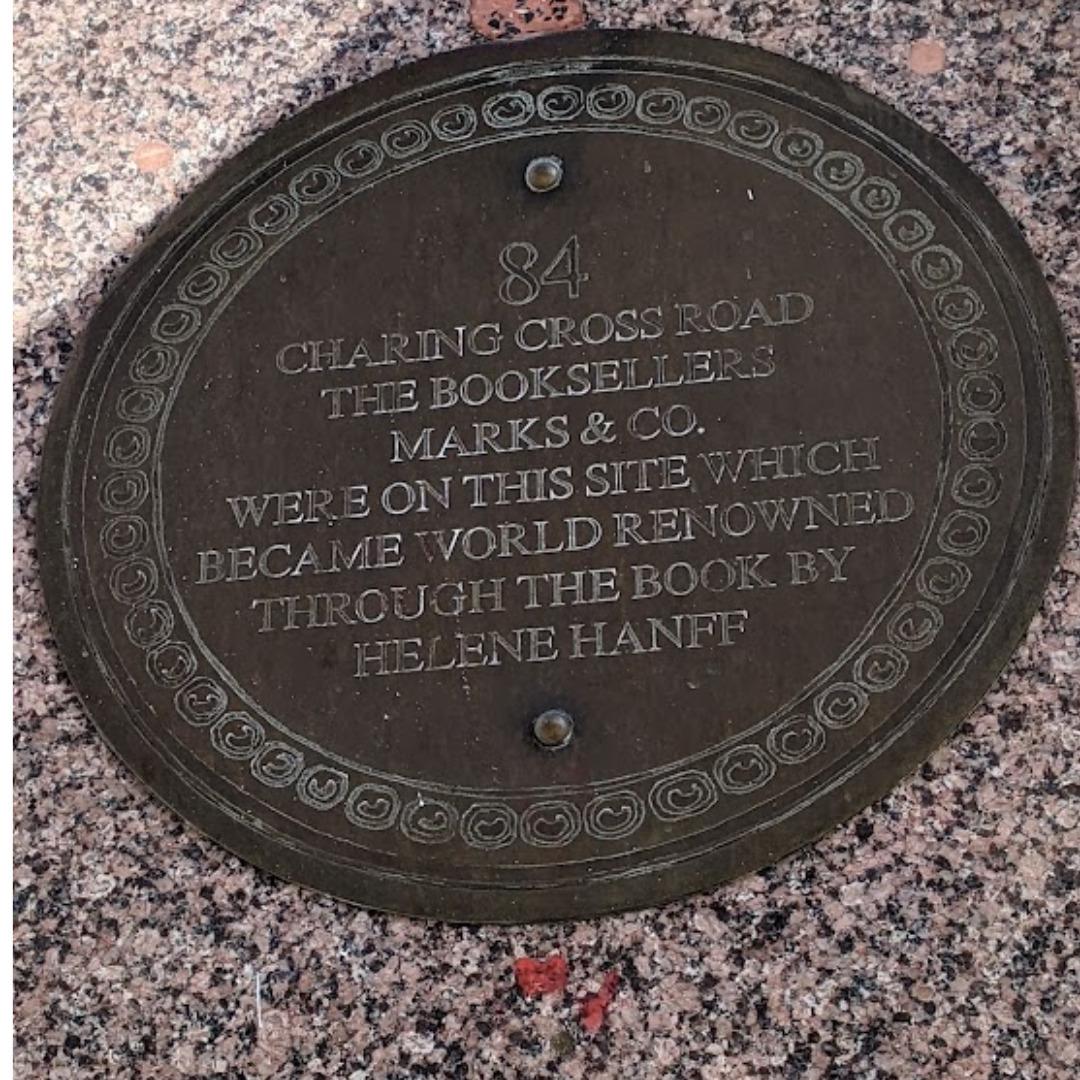 A round plaque stating: 84 Charing Cross Road The Booksellers Marks & Co. Were on this site which became world renowned through the book by Helene Hanff